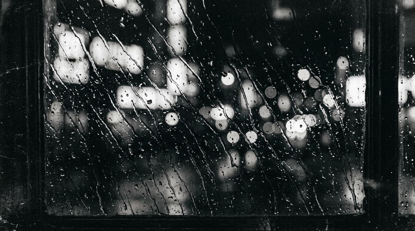 How We Disappear rain and glass scene